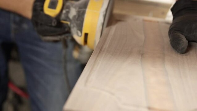 carpenter sanding wood