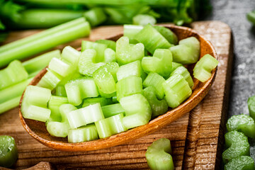 Sliced celery on a cutting board. 