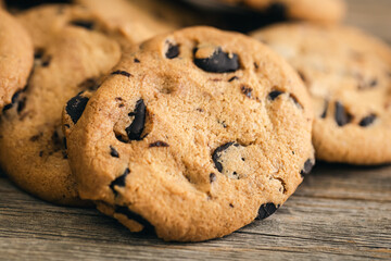 Cookies with chocolate crisps on a wooden background, close-up.