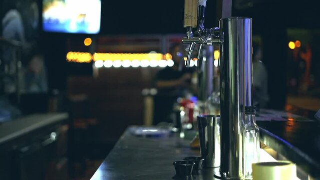 side video image of the interior of a bar 