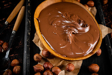 A plate of hazelnut butter on a cutting board.