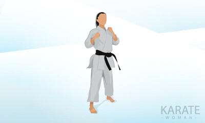 A female athlete stands in a karate combat stance. Abstract background.
