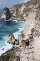 family on stairs to Diamond beach in Nusa Penida Bali