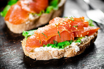 Sandwich with salmon and herbs. 