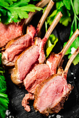 Rack of grilled lamb with parsley. 