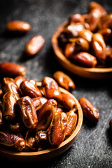 Two plates of dates on the table. 