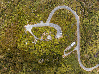 Aerial drone bird's eye view of Flagstaff Road leading up to Bluff Hill and its lookout. Bluff is a town in the Southland region of New Zealand's South Island and the southernmost town in mainland NZ.