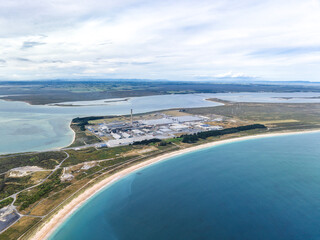 High angle aerial drone view of Tiwai Point peninsula at the entrance to Bluff Harbour on the...