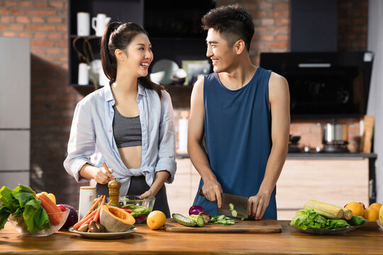 Youth companion making vegetable salad at home