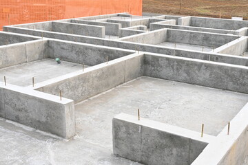 A view of the foundation construction site of a residential building. Finishing foundation work.