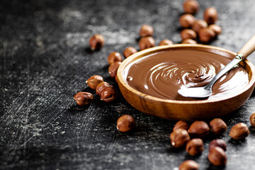 Hazelnut butter in a plate with a spoon. 