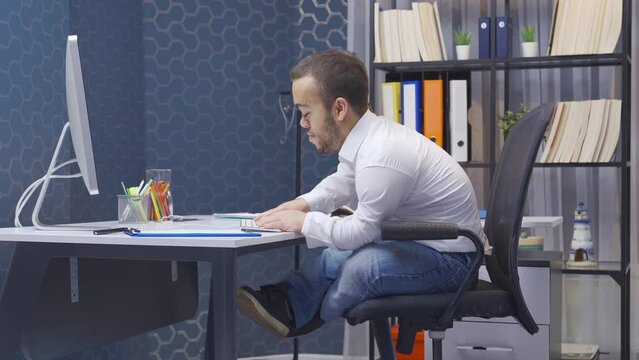 Disabled dwarf man satisfied with his job in the office.
Disabled midget man at work, loves his job. He works with a smile. He's happy.
