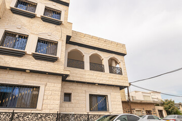 Fototapeta na wymiar One of the residential buildings in the Ghajar Alawite Arab village, located on the Golan Heights, on the border with Lebanon, in Israel