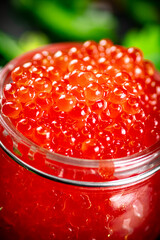 Grains of red caviar. Red caviar texture.