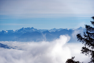 Aerial view from local mountain Uetliberg on a foggy winter day with Swiss Alps and sea of fog at Christmas Day. Photo taken December 25th, 2022, Uetliberg, Canton Zürich, Switzerland.