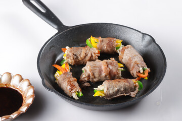 Bulgogi Rolls or Beef Rolls Stuffed with Sweet Pepper and enoki mushroom. Meat roulade.
