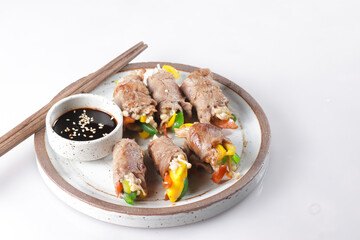 Bulgogi Rolls or Beef Rolls Stuffed with Sweet Pepper and enoki mushroom. Meat roulade.