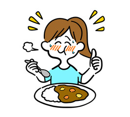 辛いカレーライスを食べている女性