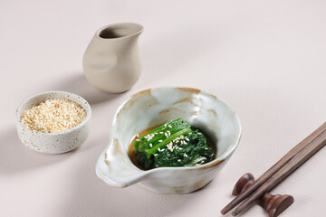Spinach Ohitashi is a Dish in wich Spinach Stepped in a Dashi Based Sauce, served with bonito flakes. 
