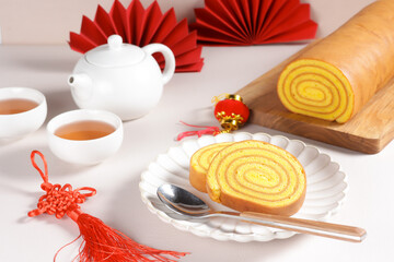 Lapis Legit Gulung is Indonesian Traditional Thousand Layered Cake Roll with Chinese New Year Red Concept.