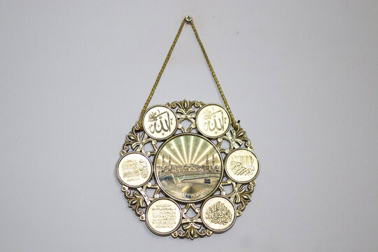  In white background, Arabic wallmate hunging above the dawal
