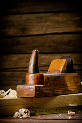 Working tool. Planer with wooden shavings. 