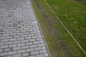 installation of a plastic mat as a replacement for the lawn. plastic permeable tiles are filled...