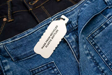 Modern clothes made from recycled plastic. Eco products concept.