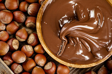 Hazelnut butter on a wooden plate. 