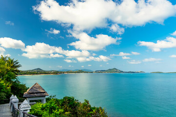 Fototapeta Beautiful view from the hill to Koh Samui. Triangular roof, turquoise sea and green mountains. obraz