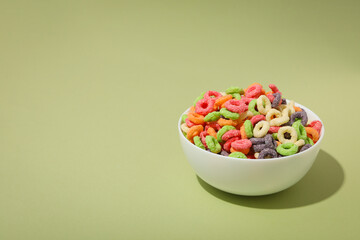 Concept of breakfast food, colorful corn flakes, space for text