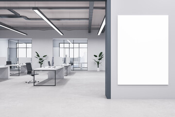 Modern concrete coworking office interior with mock up poster on wall, windows, equipment, furniture and other items. 3D Rendering.