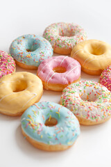 Colorful delicious donuts isolated on white background