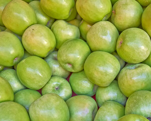 Bright green, fresh apples top view close-up. Natural, juicy background.