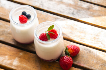 dairy dessert - yogurt with fresh strawberries in a glass
