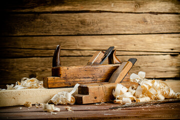 Working tool. Planer with wooden shavings. 