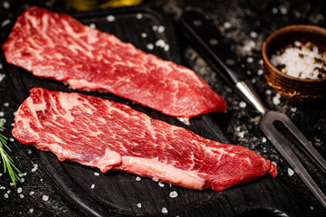 Raw steak on a cutting board. 