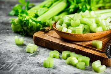 Sliced celery on a cutting board. 