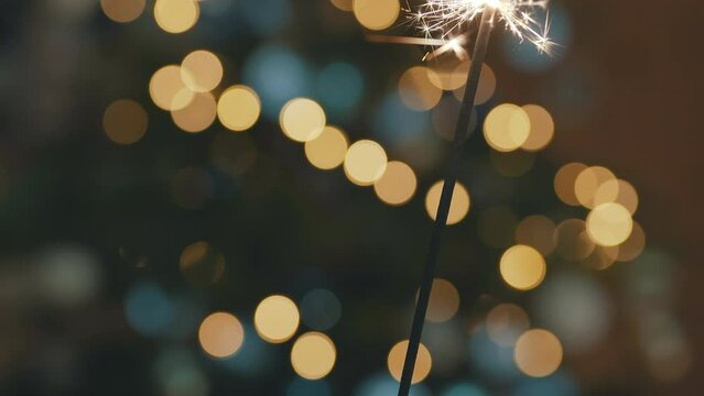 sparkler, sparkle, fire, light, ornament, decoration, decor, decorate, light, christmas, holiday, pine, tree, glass, spark, sparkles, star, stars, bokeh, orange, green, color, move, no people