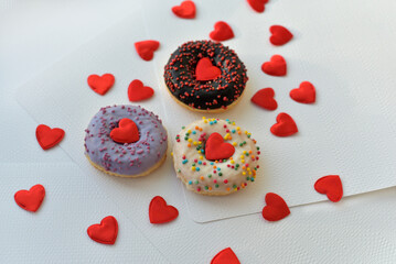 Colorful donuts and a heart. 