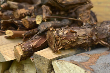 A lot of firewood lies in a heap