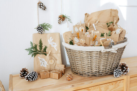 Decorated paper bags for DIY advent calendar and kept in basket