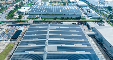 Top view Solar Cell on Warehouse Factory. Solar photo voltaic panels system power or Solar Cell on industrial building roof for producing green ecological electricity. Production of renewable energy.