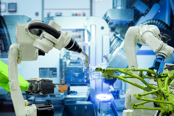 Close-up industrial robotics working with metalwork on smart factory, industry 4.0 and automation working via no people control 