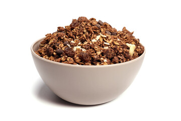 granola with oatmeal with nuts and fruits in a bowl on a white background