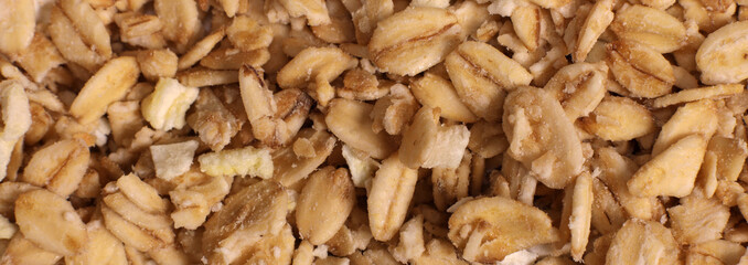 Background, texture of granola with oatmeal with nuts and fruits. Horizontal banner