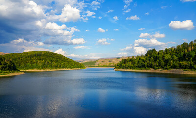 Sösetalsperre near Osterode am Harz. View of the reservoir with the surrounding idyllic nature. Landscape at the lake in the Harz National Park.
