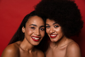 Young african american half-naked women smiling at camera