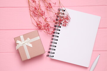 Present box on wooden background, copy space
