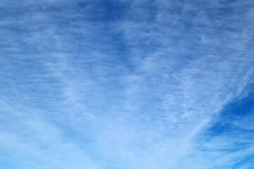 Beautiful blue sky with clouds. Background of the sky. The texture of the sky.